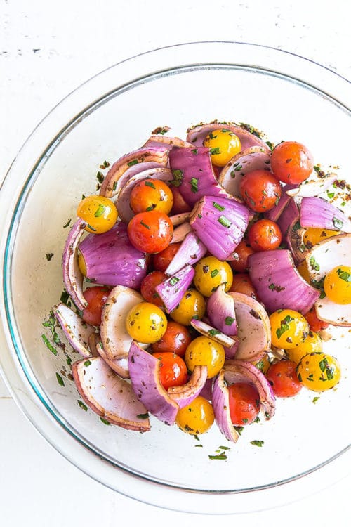 Colorful tomatoes and red onion coated in flavorful marinade. #grilledvegetables #vegetablemedley #mixedvegetables #sidedish #potluck #busycooks