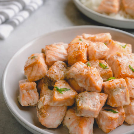 Baked salmon chunks on a serving plate.