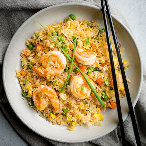 Faster than take-out, this spiced shrimp fried rice is so flavorful and easy to make! Everyone loves it, even the picky eaters! #friedrice #shrimp #shrimpfriedrice #quickdinner #easyrecipe #busycooks