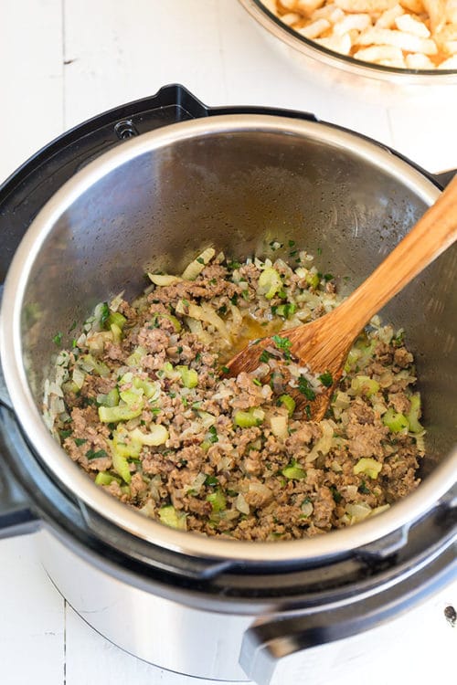 Sausage and vegetable mixture sautéd in the Instant Pot. The most aromatic part of cooking Instant Pot Sausage Stuffing. #instantpotrecipes #instantpot #sausagestuffing #thanksgivingmenu #stuffing 