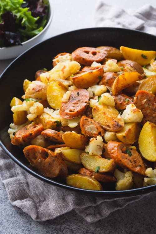 Super quick and flavorful sausage and potatoes skillet in less than 20 minutes! One skillet and only 5 ingredients to get the dinner on the table.