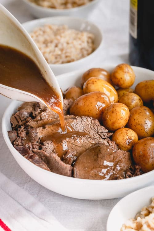 Melt-in-your-mouth tender pot roast with potatoes, barley AND rich gravy, all cooked in ONE pot in less than 90 minutes! #InstantPotrecipes #InstantPot #InstantPotPotRoast #potroast