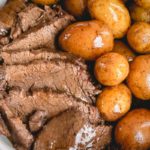 Melt-in-your-mouth tender pot roast with potatoes, barley AND rich gravy, all cooked in ONE pot in less than 90 minutes! #InstantPotrecipes #InstantPot #InstantPotPotRoast #potroast