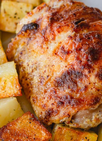 These baked mustard chicken thighs and potatoes are a flavorful and satisfying comfort meal, quick enough to make on a busy weeknight!
