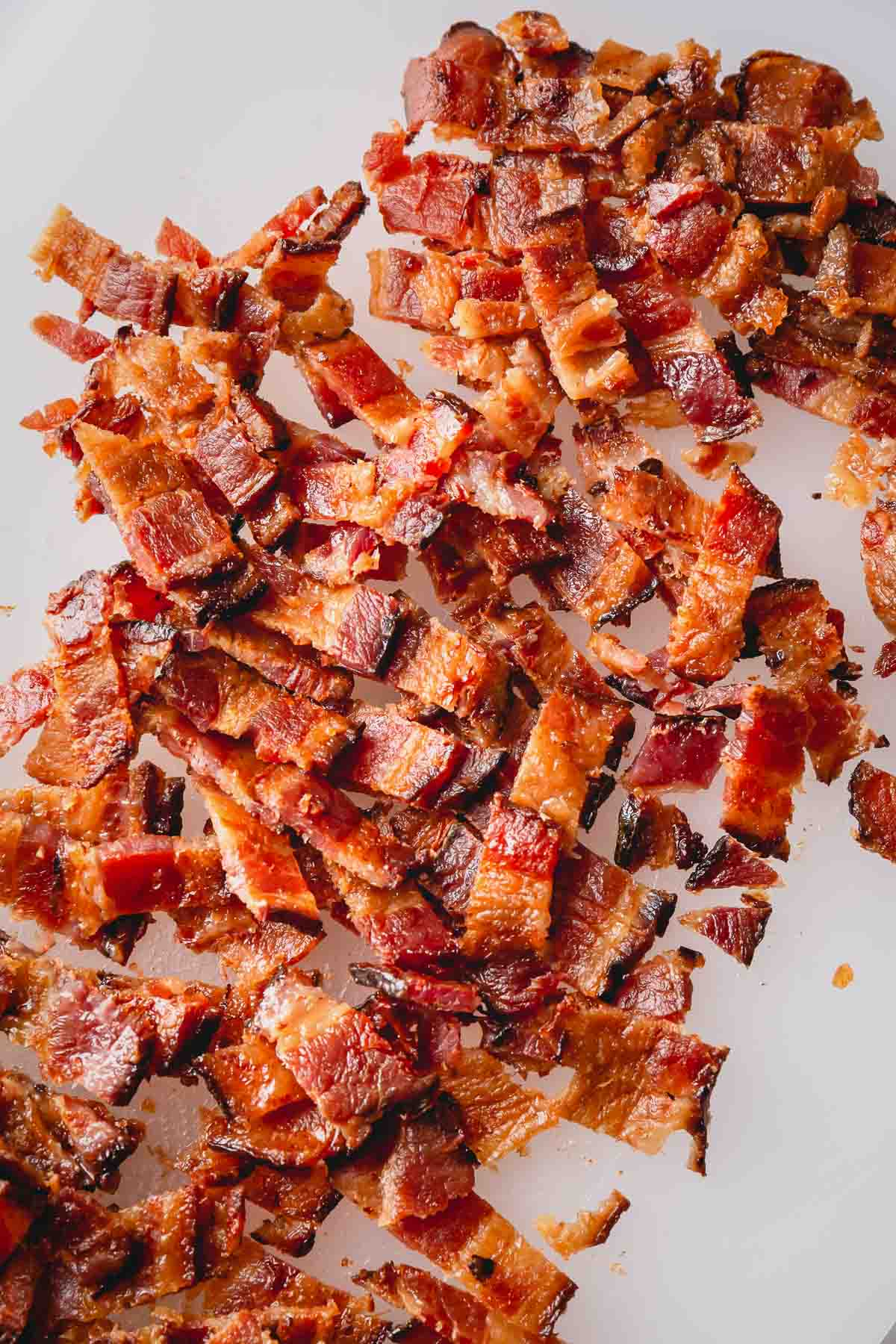 Cooked bacon chopped into pieces.