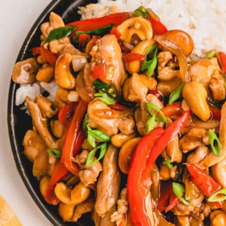 thai chicken with red peppers, cashews, and white rice.