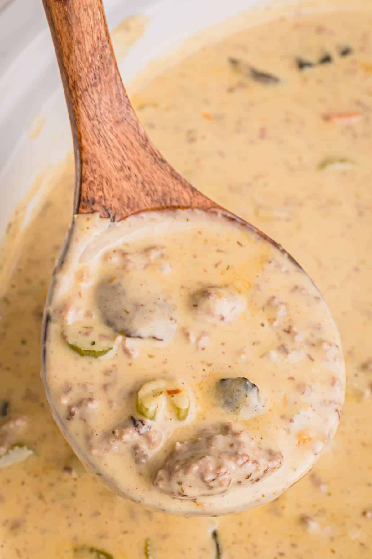 a large spoonful of cheeseburger soup.