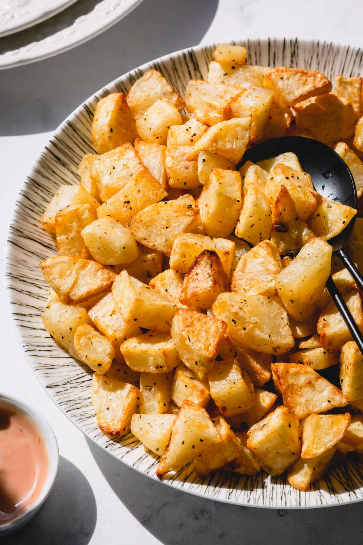 roasted potatoes on a plate. 